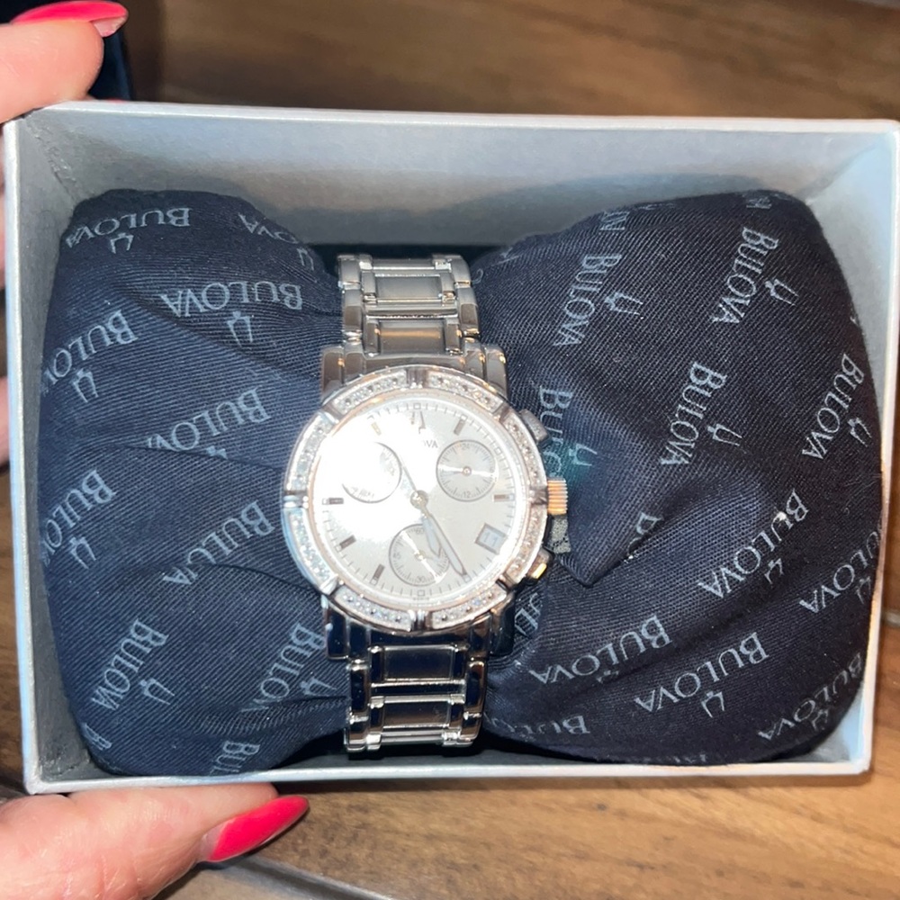 Woman’s silver bulova dress watch with diamonds.